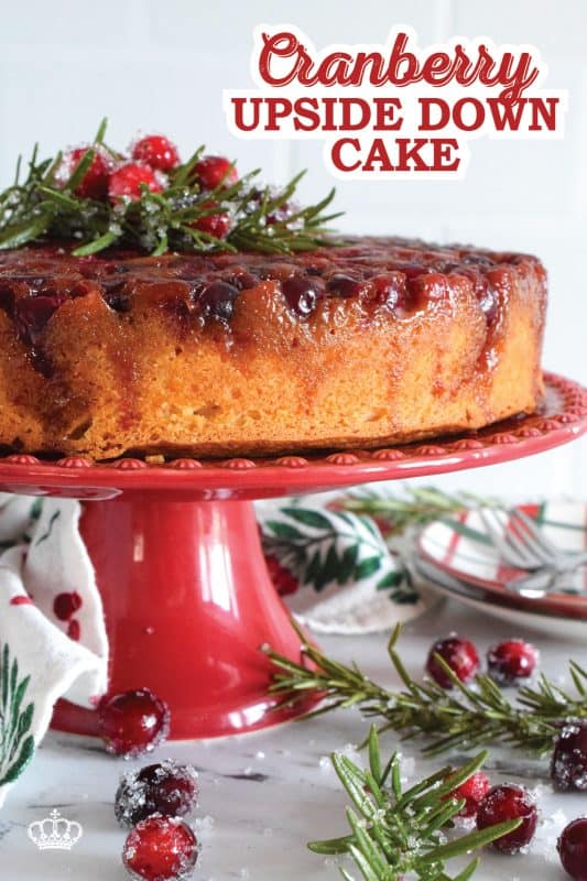 Fresh cranberries are placed in the bottom of a cake pan with a brown sugar caramel mixture. Topped with a deliciously moist vanilla batter, this Cranberry Upside Down Bundt is a perfect dessert for any holiday meal.  Garnished with cranberries and fresh rosemary sprigs, it really couldn't get any easier or any more delectable! #cranberry #cranberries #cake #upsidedown