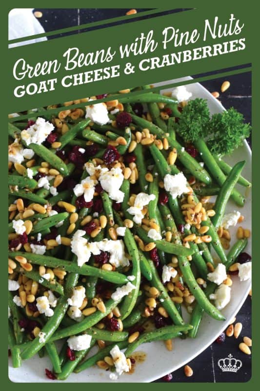 This delicious side dish prepared with green beans, toasted pine nuts, crumbled goat cheese, and dried cranberries takes only fifteen minutes in a skillet on your stovetop! How's that for a quick and easy holiday side?  Perfectly seasoned and quickly sauteed in butter, these green beans are delectably savoury! #greenbeans #cheese #pinenuts #thanksgiving #side