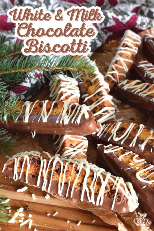When it comes to sweet treats like biscotti, you cannot go wrong with chocolate! This recipe combines both milk and white chocolate chips into a sweet, vanilla-flavoured cookie dough.  Dip and drizzle these Milk and White Chocolate Biscotti with even more chocolate to make them even better! #biscotti #chocolate #milk #white #dipped #christmas #baking #holidays