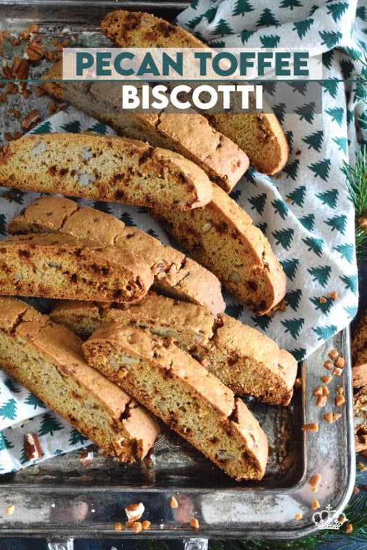 These light and crunchy Pecan Toffee Biscotti are prepared with toffee bits, toasted pecans, and warming ground cinnamon. This is a holiday confection that will be difficult to share and part with. Maybe it’s a good idea to make a double batch of these after all! #biscotti #pecan #toffee #skor #cookies