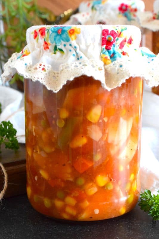 This soup is hearty and filling! Canned Vegetable Soup is in fact more like a stew than a soup! It has a dense, homestyle tomato flavour combined with lots of fresh and good-for-you vegetables too. This recipe is prepared with canning instructions for long-terms pantry storage, but you can make this soup without canning it as well! #vegetable #vegetablesoup #soup #canning #preserved #pantry #pressurecanned