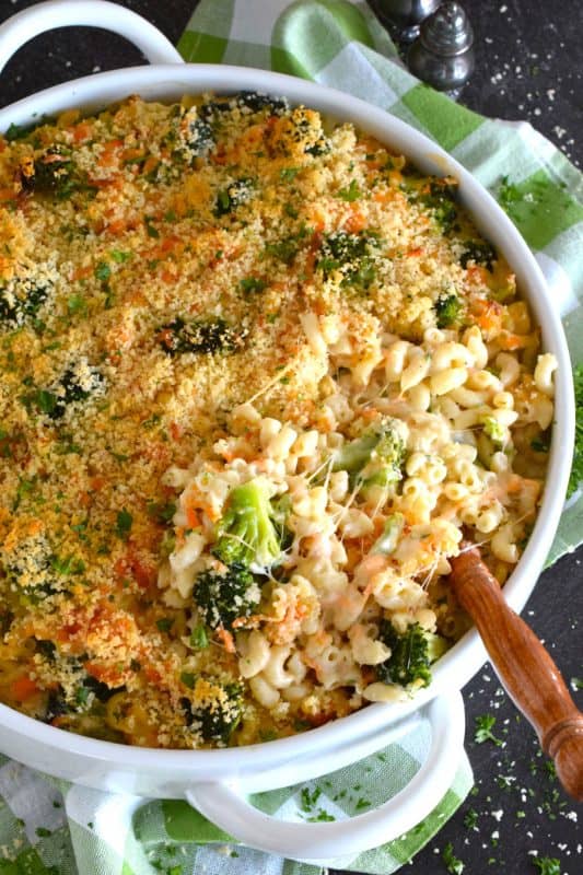 3 Cheese Broccoli Mac and Cheese starts with a classic roux paired with lots of fresh or frozen broccoli florets along with copius amounts of shredded cheddar cheese and topped with a buttery panko breadcrumb. Baked to perfection this dish is absolute perfection! #macandcheese #macaroni #cheese #cheesy #broccoli