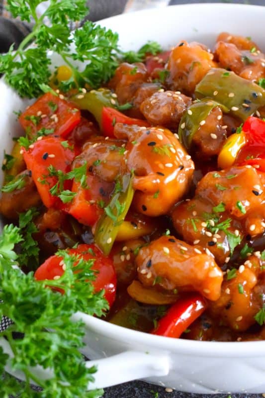 Sweet Bell Pepper Chicken is one of my favourite quick and easy weeknight chicken dinners! Boneless, skinless chicken thigh meat is deep fried and tossed with sauteed bell peppers in a homemade sweet and sour sauce. It cannot get any easier or any tastier! This chicken freezes and reheats well too, so double the recipe if you want leftovers! #bellpepper #chicken #sweet #sour #sweetandsour