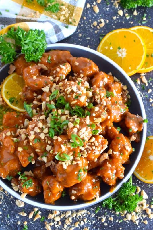 A quick and easy main perfect for a weeknight dinner at in busy household, this sweet and savoury Peanut Orange Chicken is ready to plate and serve in 45 minutes!  The bold flavours in this chicken should shine, so serve it with plain cooked rice and steamed broccoli! #peanut #orange #chicken #orangechicken #deepfried #friedchicken