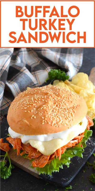 Leftover turkey never tasted so good! Shredded leftover turkey is tossed in a buffalo sauce and piled high onto your favourite sandwich bread or bun.  Topped with melted cheese and dill pickles, this Buffalo Turkey Sandwich is simple, quick, and easy, yet it tastes absolutely incredible!  #buffalo #turkey #leftover #sandwich
