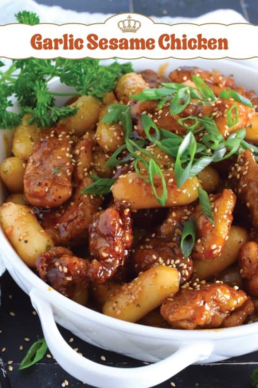 Dredged in a seasoned flour and pan-fried until golden brown, this chicken is tossed with a sweet and sticky garlic sesame sauce until thickened and glossy.  Optionally, add Korean rice cakes to make the dish stretch further or to make a heartier meal! #garlic #sesame #chicken #saucy #asian #ricecakes #tteok