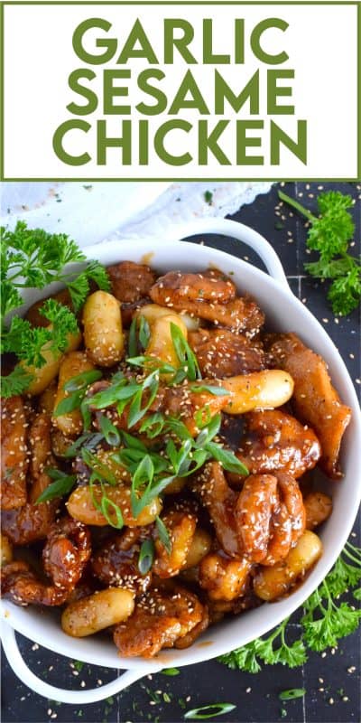 Dredged in a seasoned flour and pan-fried until golden brown, this chicken is tossed with a sweet and sticky garlic sesame sauce until thickened and glossy.  Optionally, add Korean rice cakes to make the dish stretch further or to make a heartier meal! #garlic #sesame #chicken #saucy #asian #ricecakes #tteok