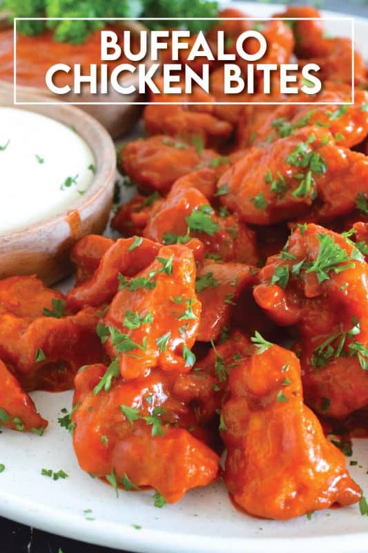 Dredged in a seasoned flour and fried until golden brown, Buffalo Chicken Bites are tossed with a quick and easy homemade buffalo sauce! Serve with your favourite ranch dipping sauce and veggies sticks. These are great as an appetizer for game day! #buffalo #buffalosauce #chicken #spicy #franks #bites #sauce
