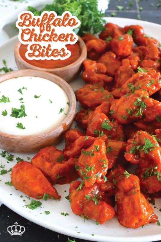 Dredged in a seasoned flour and fried until golden brown, Buffalo Chicken Bites are tossed with a quick and easy homemade buffalo sauce! Serve with your favourite ranch dipping sauce and veggies sticks. These are great as an appetizer for game day! #buffalo #buffalosauce #chicken #spicy #franks #bites #sauce