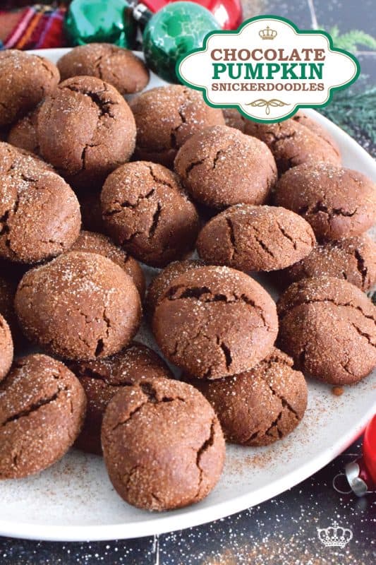 Everyone loves the original snickerdoodle cookie, but this pumpkin version is even more delicious! Prepared with brown sugar and cocoa, the cookies are also packed with pumpkin spice seasoning blend and rolled with it and sugar, which gives the cookie that recognizable and familiar crinkly appearance. Chocolate Pumpkin Snickerdoodle Cookies are soft and chewy with slightly crispy outer edges. #pumpkin #pumpkinspice #snickerdoodle #cookies #chocolate #holiday