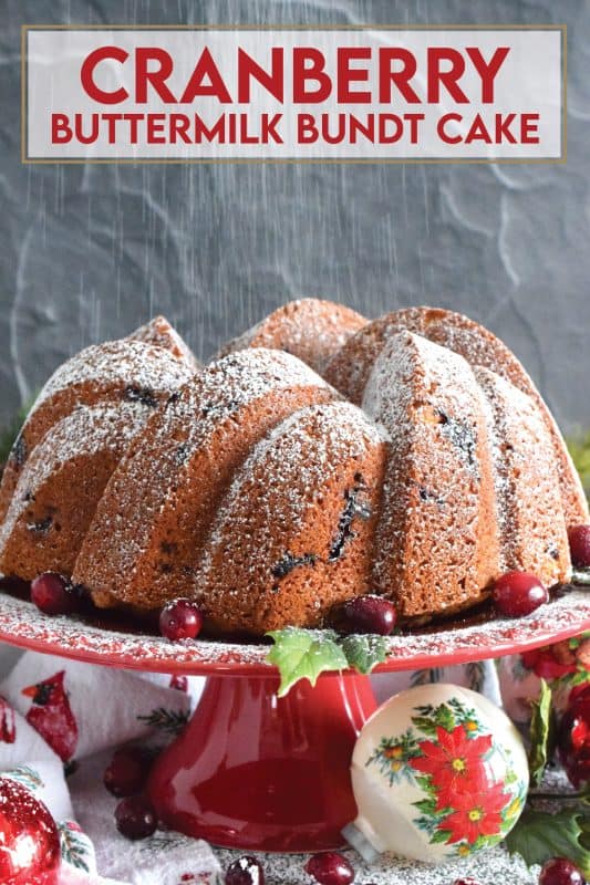 A moist and delicious bundt cake made especially for Christmas. This Cranberry Buttermilk Bundt Cake is a spin on the classic Kentucky Butter Cake. Prepared with fresh cranberries, orange zest, and orange extract, this cake is kept soft and moist because it's made with buttermilk - each slice is perfection! #cranberry #cake #bundt #buttermilk #buttercake #christmas #holiday #dessert