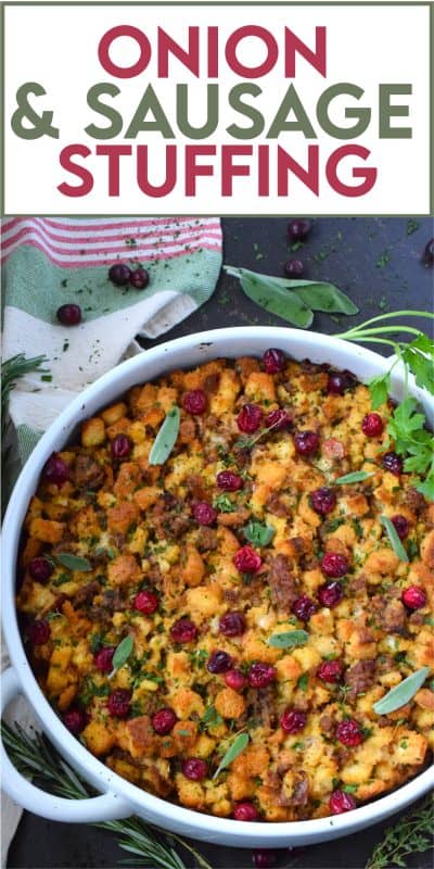 Stale bread cubes are combined with onion, butter, fresh herbs, fresh cranberries, and fried sausage meat. Moistened with stock, whisked eggs, and cheese, this Onion and Sausage Stuffing just might be the most favoured side dish! Bake it in a pan on its own or stuff the turkey with it – this stuffing is delicious both ways! #stuffing #sausage #pork #thanksgiving