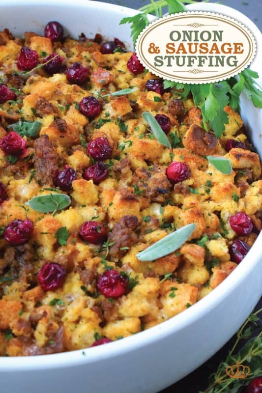 Stale bread cubes are combined with onion, butter, fresh herbs, fresh cranberries, and fried sausage meat. Moistened with stock, whisked eggs, and cheese, this Onion and Sausage Stuffing just might be the most favoured side dish! Bake it in a pan on its own or stuff the turkey with it – this stuffing is delicious both ways! #stuffing #sausage #pork #thanksgiving