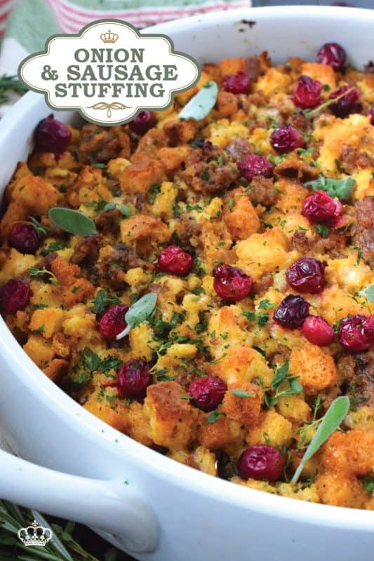 Stale bread cubes are combined with onion, butter, fresh herbs, fresh cranberries, and fried sausage meat. Moistened with stock, whisked eggs, and cheese, this Onion and Sausage Stuffing just might be the most favoured side dish! Bake it in a pan on its own or stuff the turkey with it – this stuffing is delicious both ways! #stuffing #sausage #pork #thanksgiving