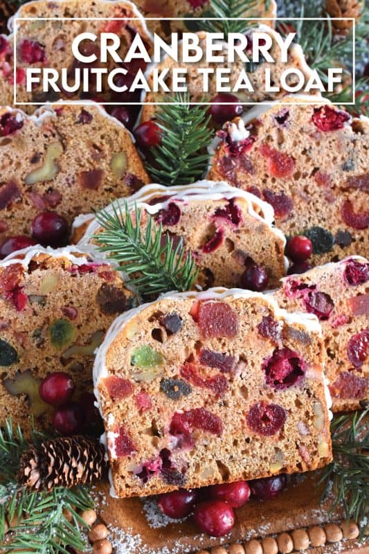 Serve this Cranberry Fruitcake Tea Loaf with a cup of hot tea and enjoy some peace and quiet on a lazy, snowy afternoon. Prepared with fresh cranberries, walnuts, and dried and candied fruit which have been soaked in brewed tea to soften and moisten. This tea loaf is delicious! #cranberry #fruitcake #tealoaf #christmas #tea