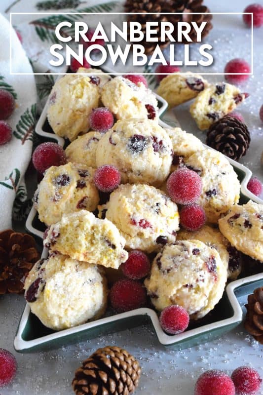 Holiday Cranberry Snowballs are packed with sweet and chewy dried cranberries that have been reconstituted with a cup of hot tea. Prepared with the most basic of pantry ingredients, these snowball cookies are nothing short of extraordinary, and they taste so delicious especially with a splash of orange extract! #holiday #baking #christmas #cranberries #snowballs #cookies