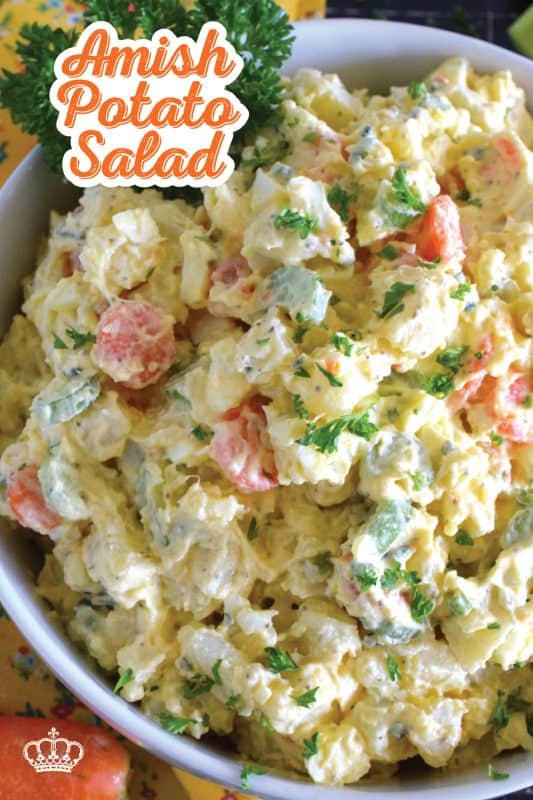 Ten years ago on a family road trip to Pennsylvannia, I tasted this Amish Potato Salad for the first time at a roadside barbecue restaurant.  It took me ten years to find that exact recipe! With a sweet, tangy, sour dressing, and it's distinctive yellow colour, this potato salad is absolute perfection! #amish #potatosalad #salad #amishsalad