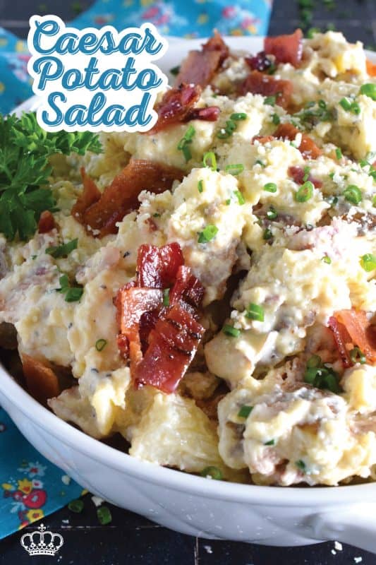 Forego the chopped lettuce and replace it with cubed baked potato to make the most delicious Caesar Potato Salad.  Loaded with bacon, hard-boiled eggs, fresh chives, and parmesan cheese, this salad is tossed with a caesar and mayo dressing.  #caesar #salad #potato #potatosalad #bakedpotato