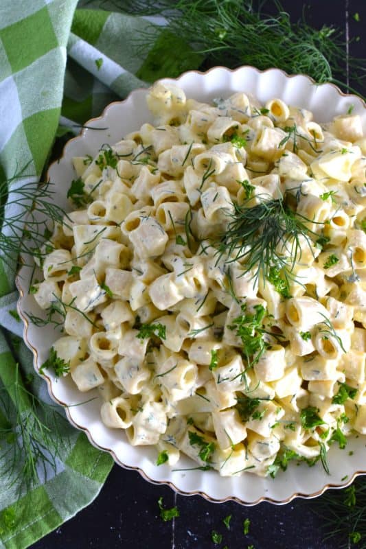 The simplicity of a Dill and Egg Pasta Salad is what makes it so delicious and appealing to the masses. You can buy ready-made pasta salads from any grocer, but why would you when you can make them so much better at home? Plus, you get to control the amount of preservatives too! #dill #dillpickle #pasta #pastasalad