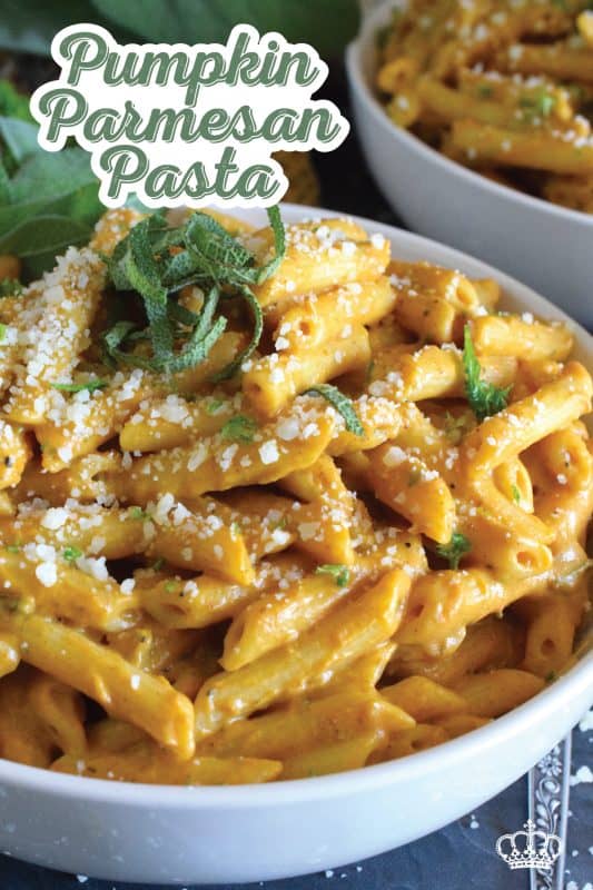 The most delicious and comforting bowl of cool weather pasta awaits! Pumpkin Parmesan Pasta is prepared with a creamy sauce made with pumpkin puree, heavy cream, sour cream, and vegetable stock. Finished with freshly grated parmesan and fresh sage, this is one pasta recipe you'll to make over and over again! #pasta #pumpkin #pumpkinpuree #pumpkinspice #pennepasta #fallrecipes