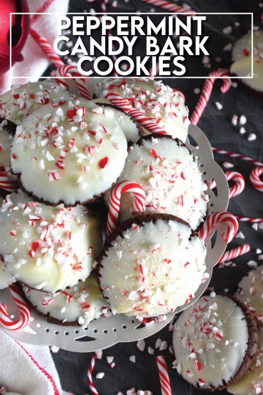 Peppermint Candy Bark Cookies are prepared with a deep, rich, chocolate cookie base made extra chocolatey with good cocoa.  Infused with lots of candy cane flavour, they look extra festive with a quick dip in melted bark and a sprinkling of crushed candy canes. #chocolate #candycanes #peppermint #almondbark #cocoa