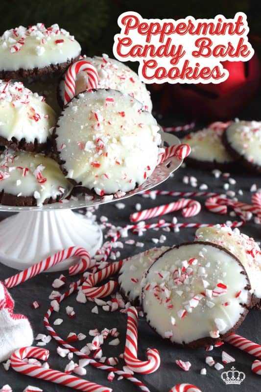 Peppermint Candy Bark Cookies are prepared with a deep, rich, chocolate cookie base made extra chocolatey with good cocoa.  Infused with lots of candy cane flavour, they look extra festive with a quick dip in melted bark and a sprinkling of crushed candy canes. #chocolate #candycanes #peppermint #almondbark #cocoa