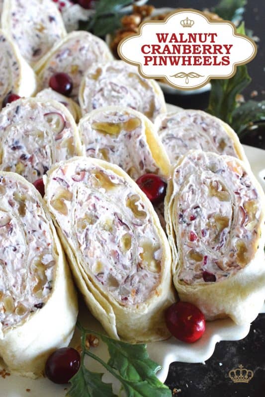 Little appetizers made with tortillas are often called pinwheels and they are very popular! Not only are they easy to make and quite delicious too, but they are adaptable to any occasion! This particular pinwheel is stuffed with a slightly sweetened cream cheese and chopped cranberries and toasted walnuts - they are so delicious! #pinwheels #appetizer #cranberry #cranberries #walnuts #christmas #holiday