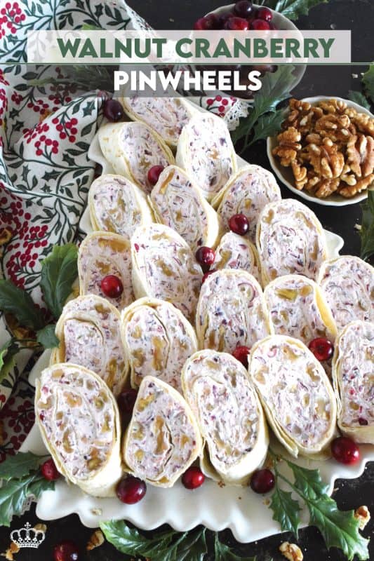 Little appetizers made with tortillas are often called pinwheels and they are very popular! Not only are they easy to make and quite delicious too, but they are adaptable to any occasion! This particular pinwheel is stuffed with a slightly sweetened cream cheese and chopped cranberries and toasted walnuts - they are so delicious! #pinwheels #appetizer #cranberry #cranberries #walnuts #christmas #holiday