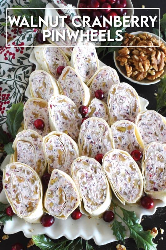 Little appetizers made with tortillas are often called pinwheels and they are very popular! Not only are they easy to make and quite delicious too, but they are adaptable to any occasion! This particular pinwheel is stuffed with a slightly sweetened cream cheese and chopped cranberries and toasted walnuts - they are so delicious! #pinwheels #appetizer #cranberry #cranberries #walnuts #christmas #holiday
