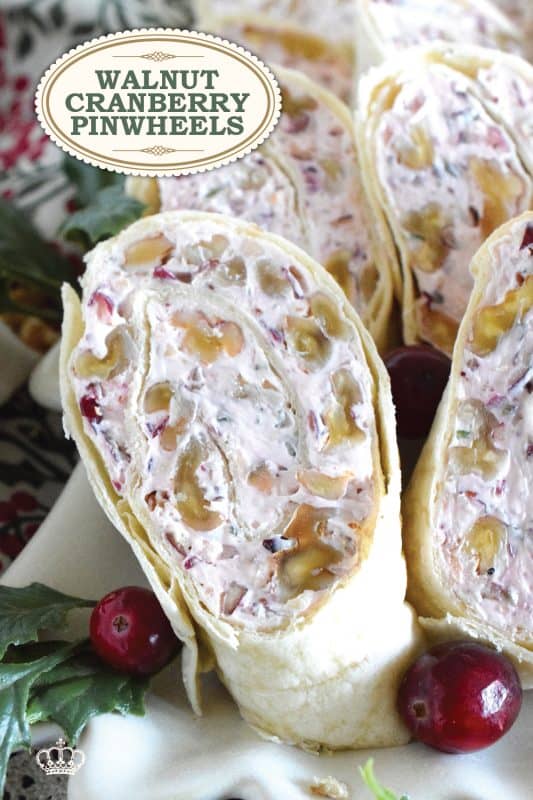 Little appetizers made with tortillas are often called pinwheels and they are very popular! Not only are they easy to make and quite delicious too, but they are adaptable to any occasion! This particular pinwheel is stuffed with a slightly sweetened cream cheese and chopped cranberries and toasted walnuts - they are so delicious! #pinwheels #appetizer #cranberry #cranberries #walnuts #christmas #holiday
